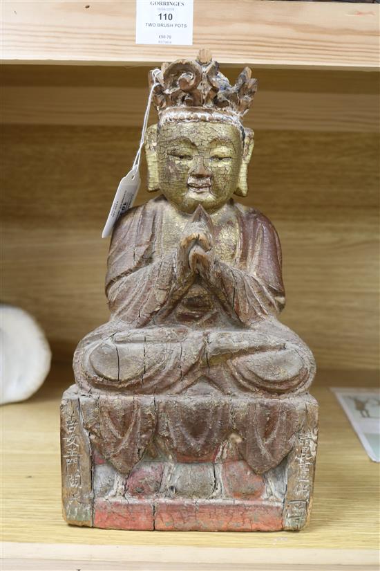 A Chinese gilt and polychrome wood seated figure of Buddha height 32cm